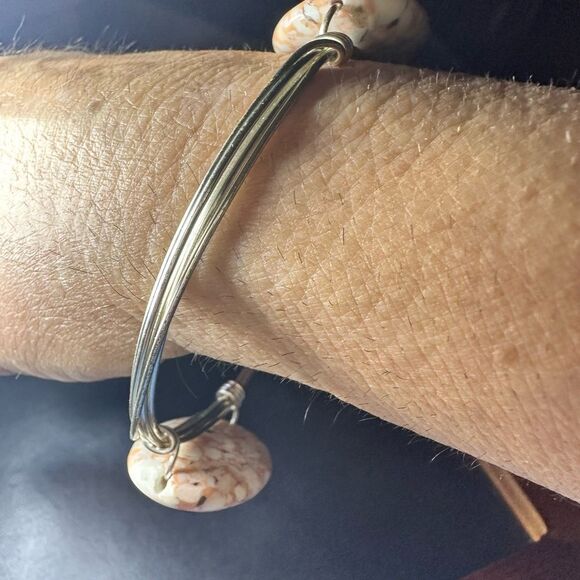 Silver wired metal bracelet with two oval brown swirled stones - Picture 3 of 8